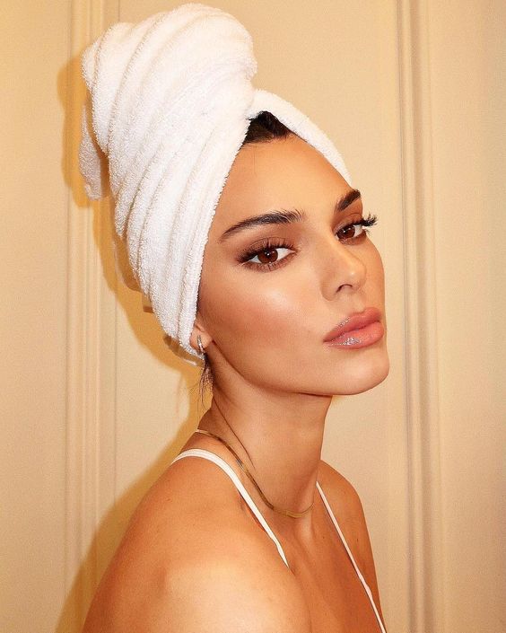 Close up shot of Kendall Jenner with her hair wrapped in a towel